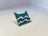 Pin coleccionable del Clan del Río